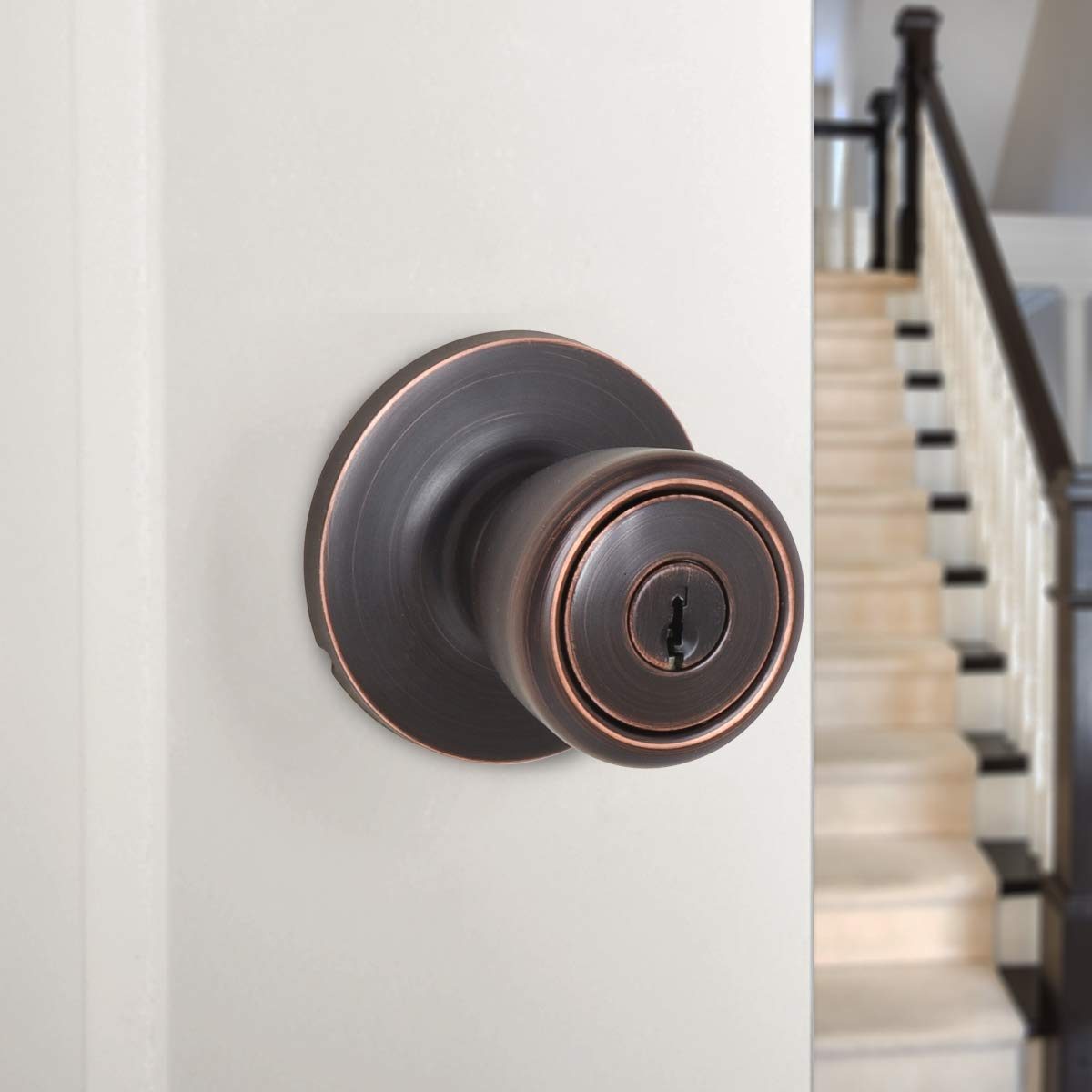 AmazonBasics Exterior Door Knob With Lock, Bell, Oil Rubbed Bronze
