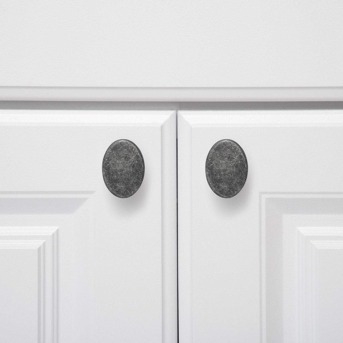 AmazonBasics Flat Oval Cabinet Knob, 1.44" Diameter, Antique Silver, 10-Pack